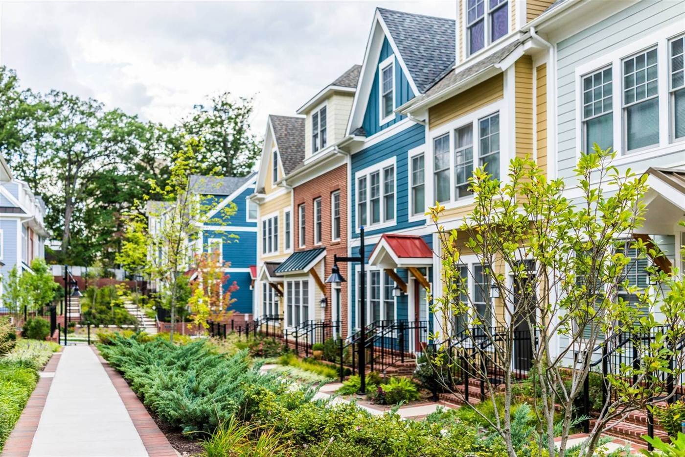 Colorful townhouses along a landscaped walk