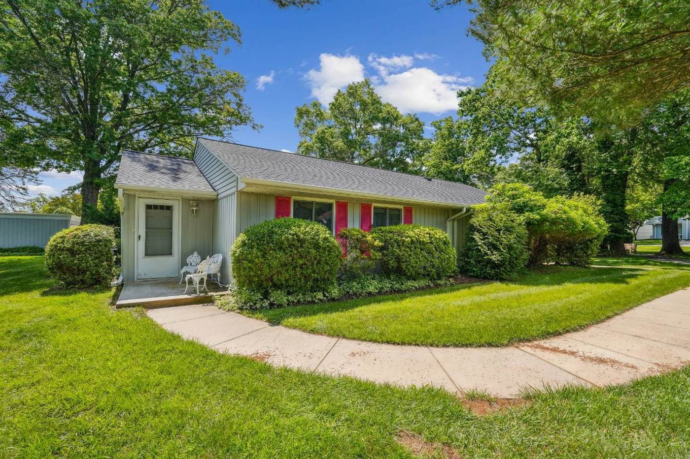 Leisure World ranch home with pink shutters